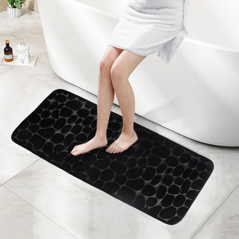 SoftTouch Cobblestone Pattern Memory Foam Bath Mat is machine washable and non-slip, making it a perfect addition to any bathroom. The absorbent polyester material resists stains, making it ideal for use in the bathtub or kitchen. This home decor runner