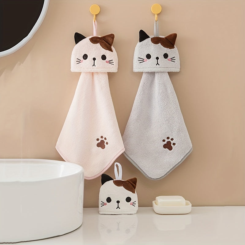 Soft coral fleece hand towel embroidered with a cat design - cute and absorbent for kitchen and bathroom use.