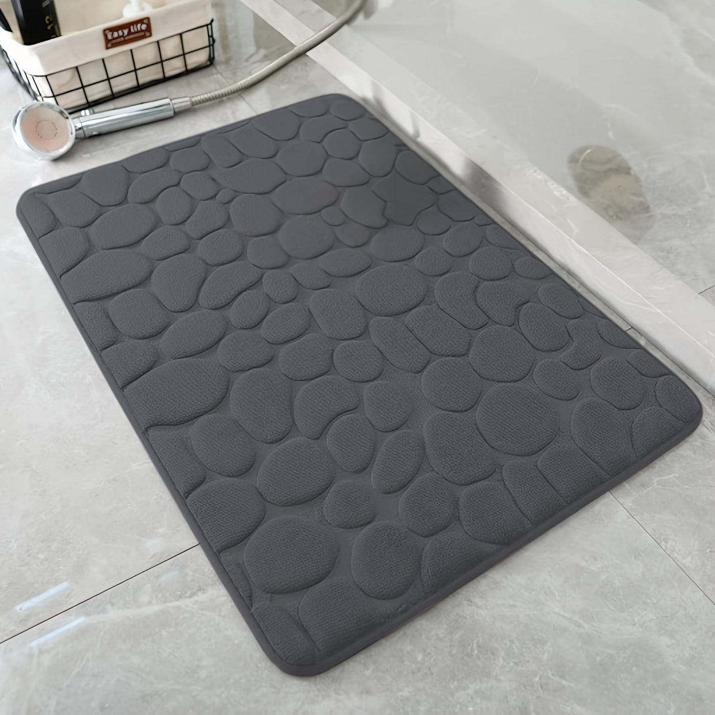 Pebble pattern bath mat in blue winter wonderland design. Non-slip, absorbent, machine washable, and fluffy.