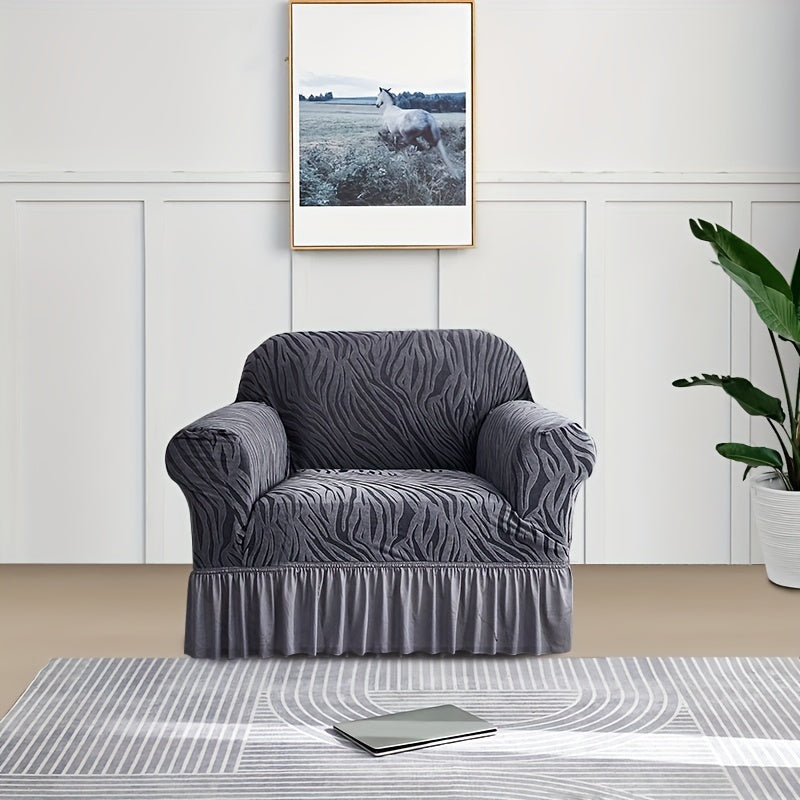 Wave pattern sofa slipcover with skirt, non-slip and dustproof. Protects furniture from cat scratches. Machine washable for easy cleaning. Suitable for bedroom, office, or living room décor.