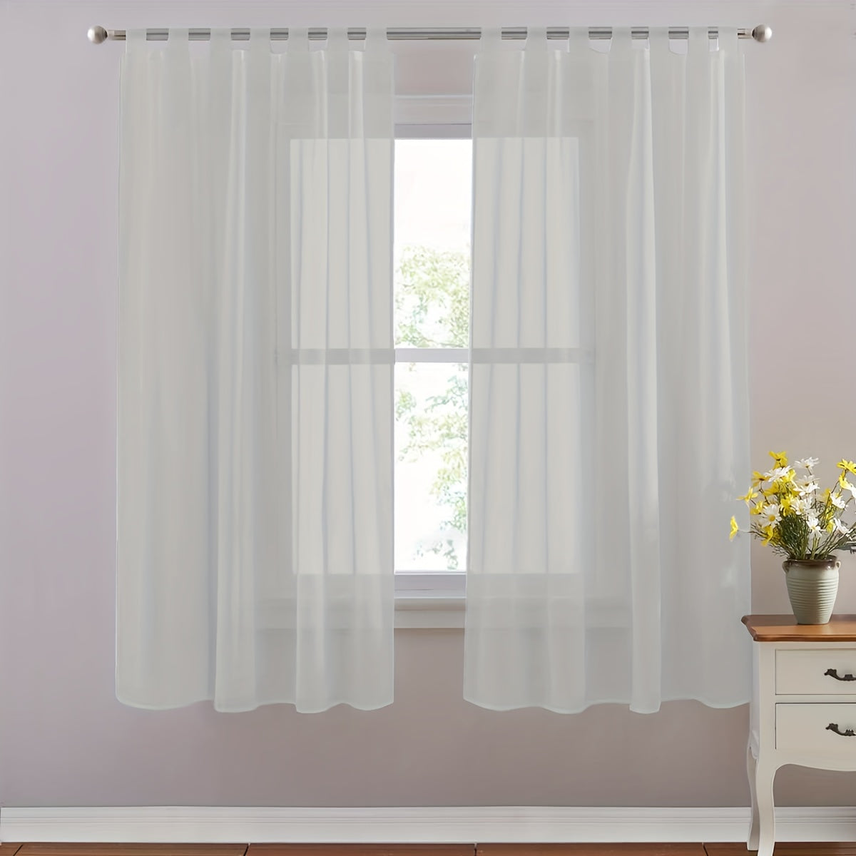 Set of 2 lightweight solid white sheer curtains with tab tops, perfect for bedroom, living room, and dining room. Includes 2 pieces.