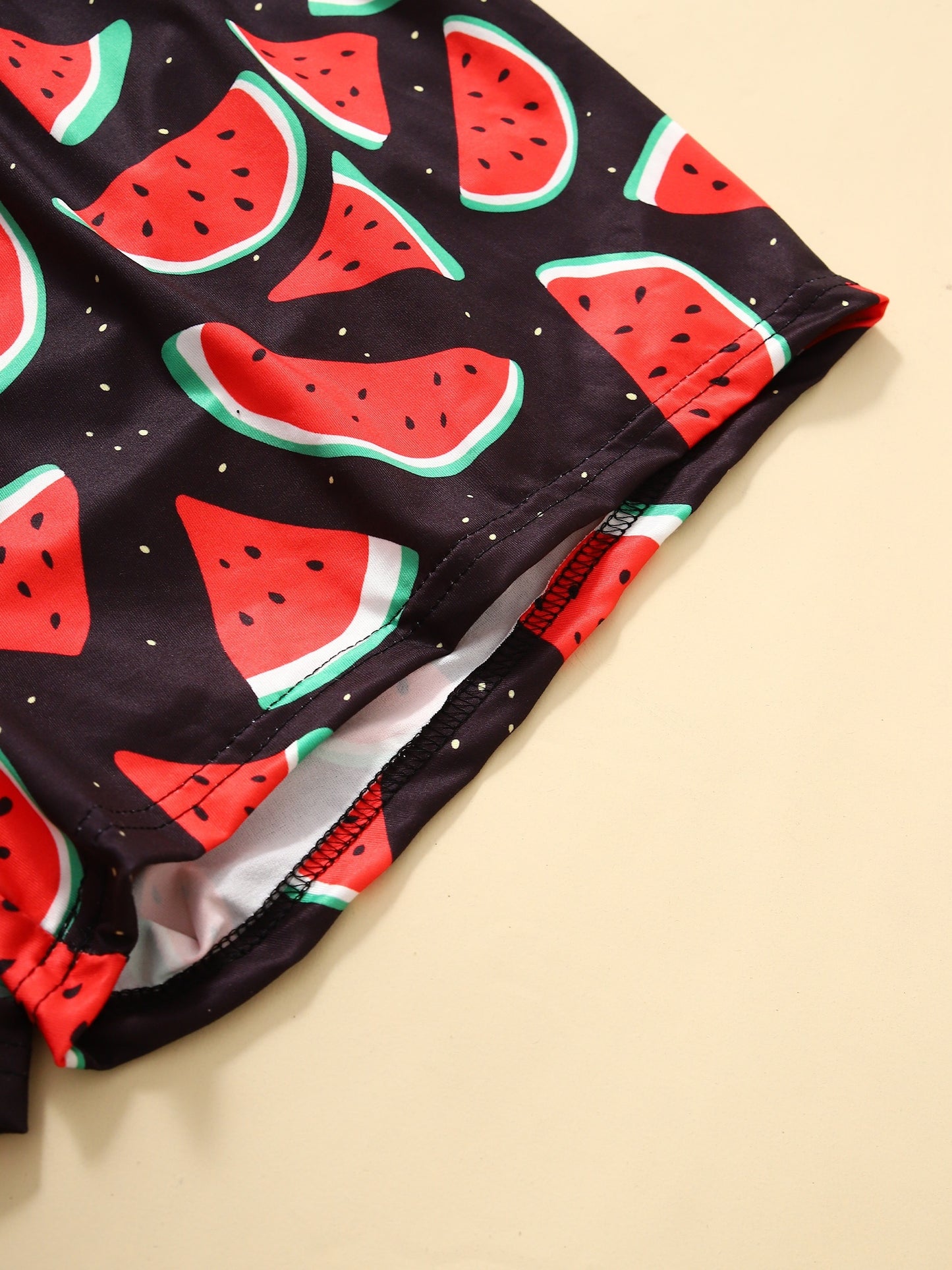 Women's loungewear set with watermelon and letter print, including short sleeve top and elastic shorts.