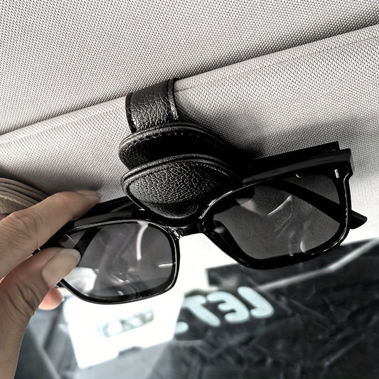 Universal car sun visor clip made of PVC material for storing eyeglasses in the vehicle interior.