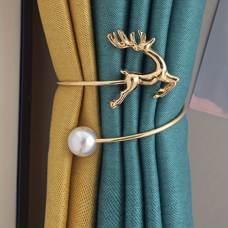 The golden coiled curtain tieback showcases a delicate deer and pearl motif.