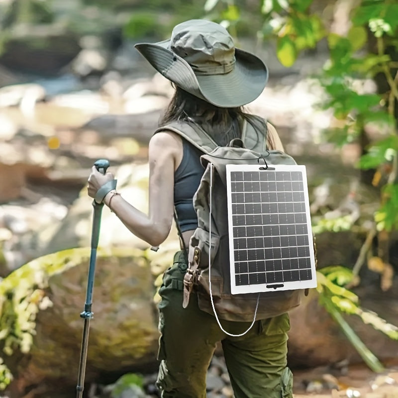 Solar panel charger for outdoor travel and camping, suitable for charging mobile devices and batteries.