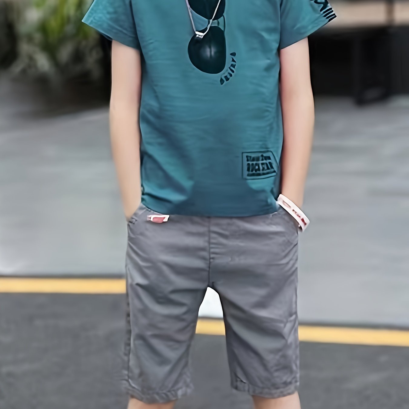 Boys' two-piece set with glasses print t-shirt and shorts, ideal for summer outdoor activities.