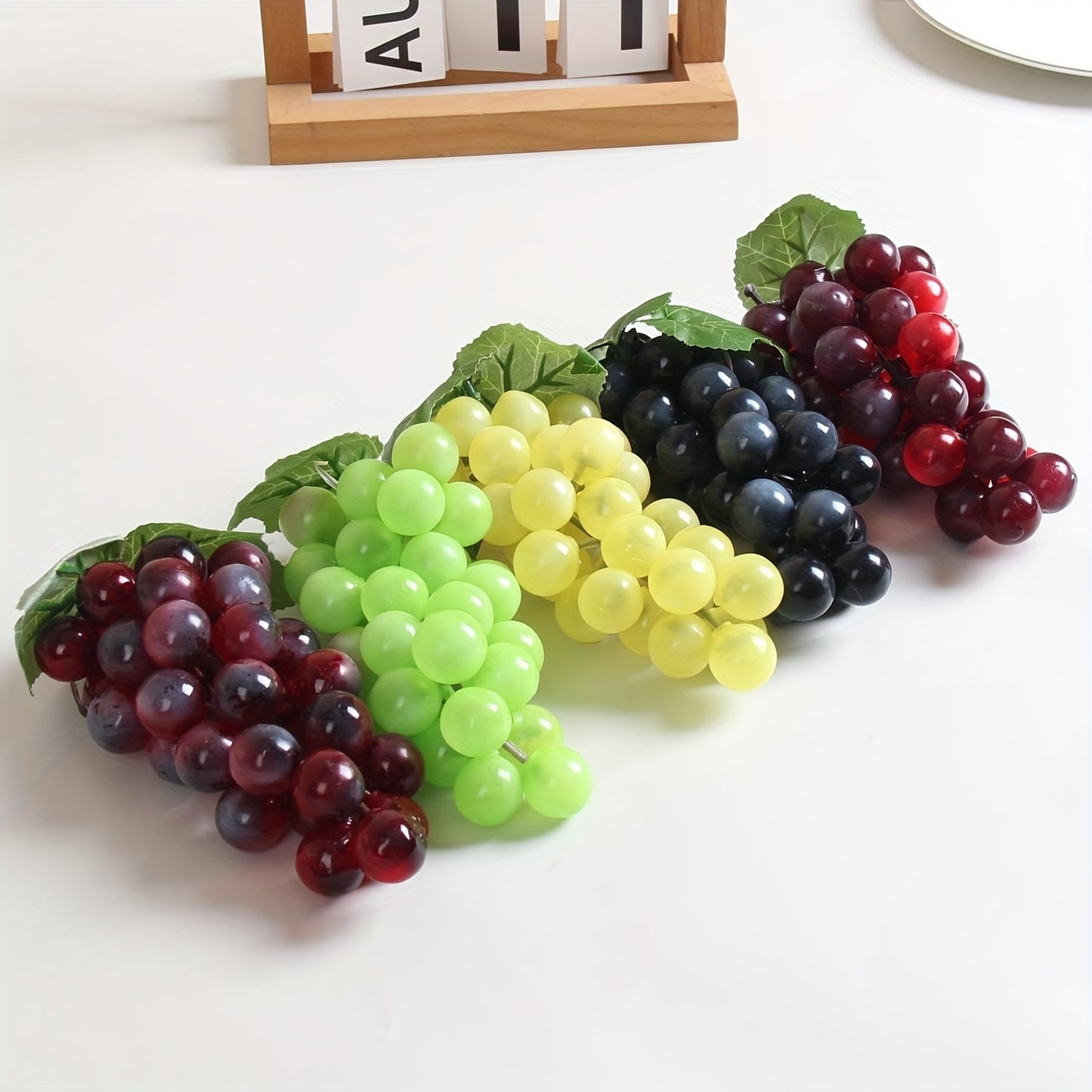 A string of artificial grapes with 36 large beads per string can be hung up for Halloween and Thanksgiving parties, as well as for weddings, kitchen displays, and Christmas gifts.