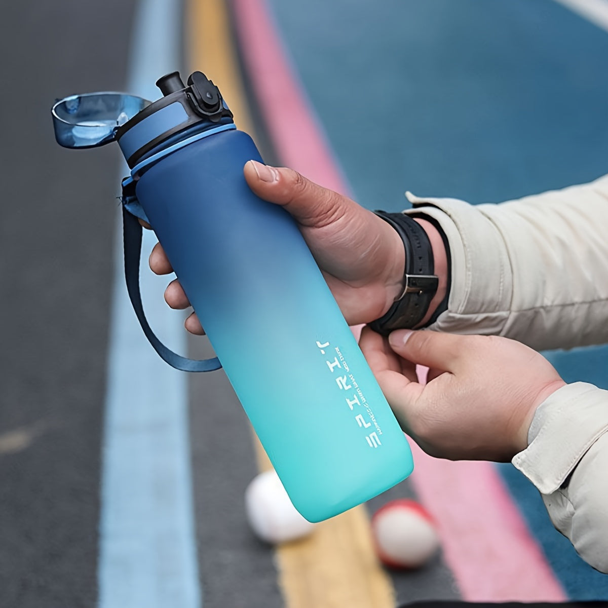 Portable Gradient Sports Water Bottle in 26oz or 10.5oz sizes, leakproof, dishwasher safe for outdoor use.