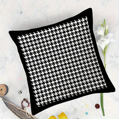 This reversible Contemporary Houndstooth Throw Pillow Cover measures 44.96cm and features a zipper closure. Made of woven polyester, this machine washable cushion case is perfect for living room decor. The black and white design adds a modern touch and