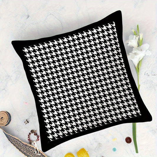 This reversible Contemporary Houndstooth Throw Pillow Cover measures 44.96cm and features a zipper closure. Made of woven polyester, this machine washable cushion case is perfect for living room decor. The black and white design adds a modern touch and