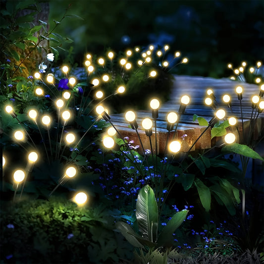 Solar LED firefly lights for outdoor garden decoration, ideal for parties, weddings, and landscapes. Available in packs of 4, 8, or 12 LEDs.