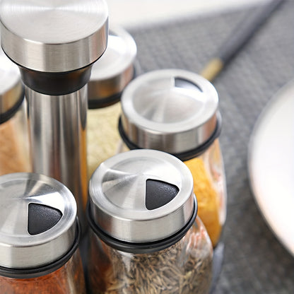 Revolving spice rack set includes 6 or 12 jars with 360° rotation shelf and glass refill containers for cabinet or countertop. Spices not included.