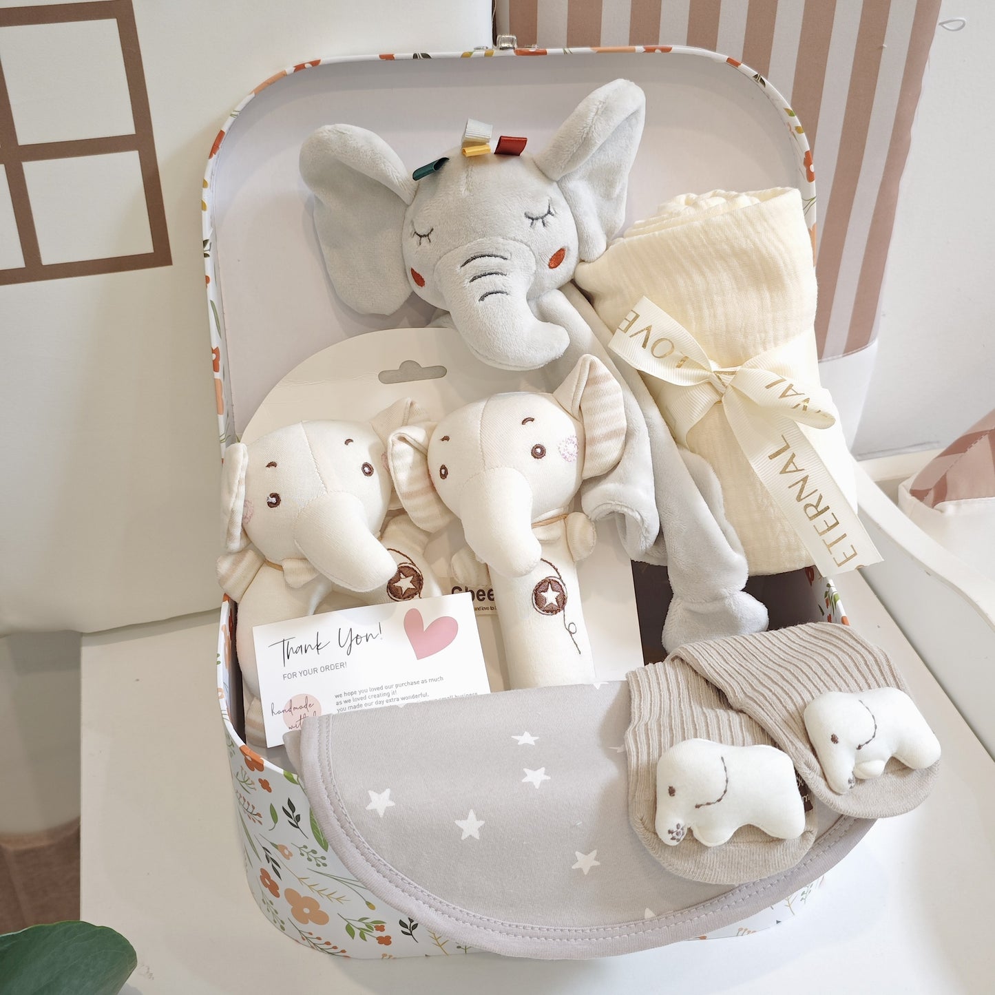 Set of 5 Baby Shower Gifts for Boys and Girls, including a baby gift basket with essentials like a blanket, lovey, socks, and more. Ideal for newborns.