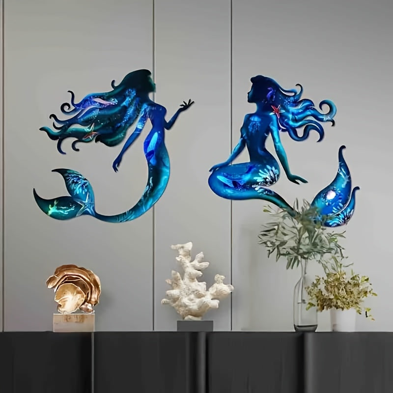 Ocean-themed metal mermaid wall art for indoor or outdoor nautical decor.