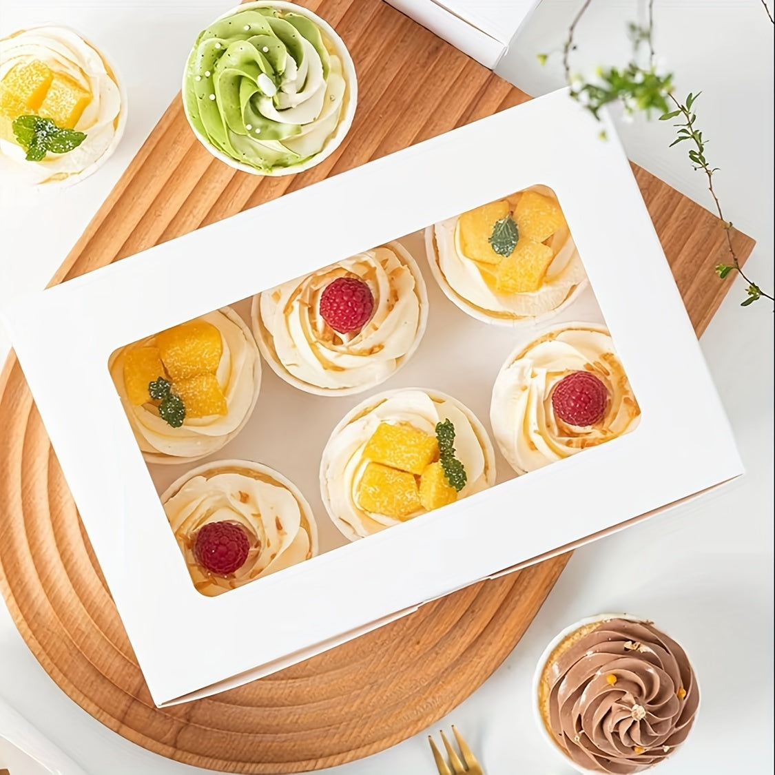 10 to 50 pieces of cupcake boxes in varying sizes (1, 2, 4, 6, 12 holes) with a transparent window. These white cardboard boxes are perfect for muffins, tarts, biscuits, snacks, desserts, and cakes. Ideal for use in cake houses, parties, bakeries, and as