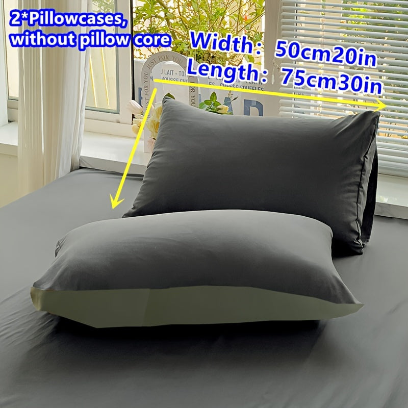 Two polyester pillowcases for bedroom use, featuring a multi-colored solid design.