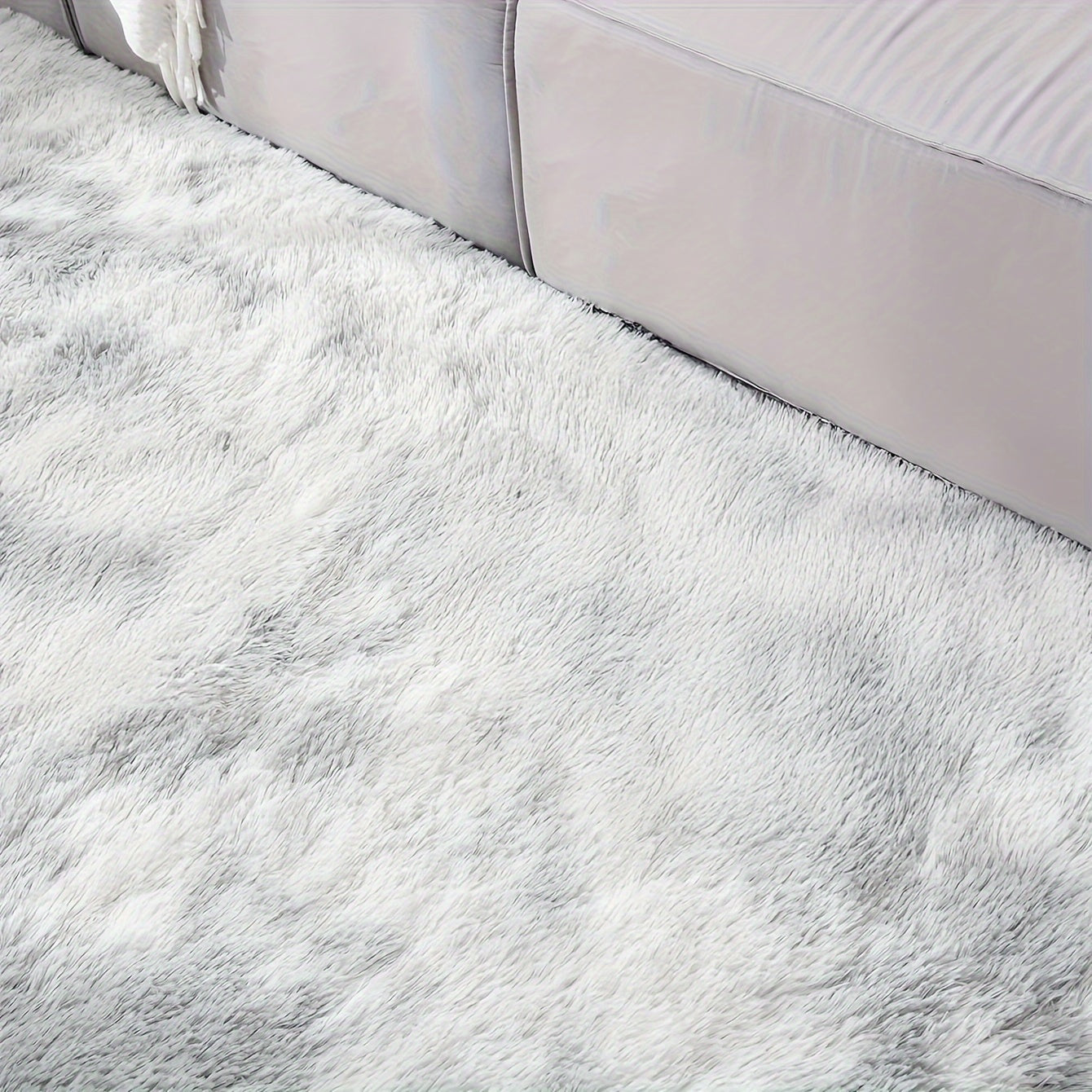 Soft and fluffy rectangle area rug perfect for your bedroom. This plush carpet is thick and non-slip, making it ideal for your living room. Made with machine-made polyester fiber, this low-pile rug is washable for easy cleaning. Perfect for indoor use.