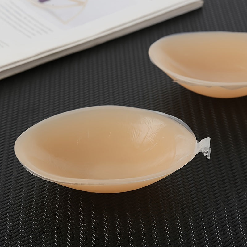 Invisible silicone strapless bra with self-adhesive backless push-up nipple covers for women. lingerie and underwear accessory.