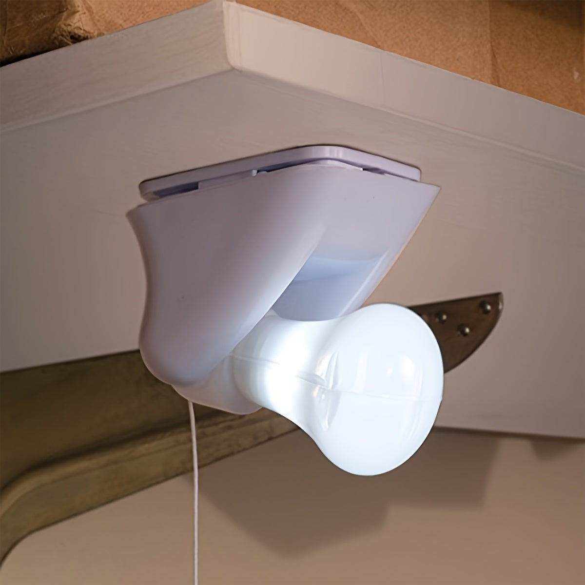 Small white LED night light; battery-powered with cordless design for bedside or cabinet; easy wall mount installation.