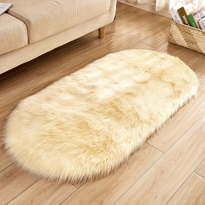 Soft and plush faux sheepskin oval area rug, perfect for adding a cozy touch to any living room or bedroom. Machine washable and designed to be used as a bedside rug. This shaggy plush carpet will enhance your home decor and add a touch of luxury to any