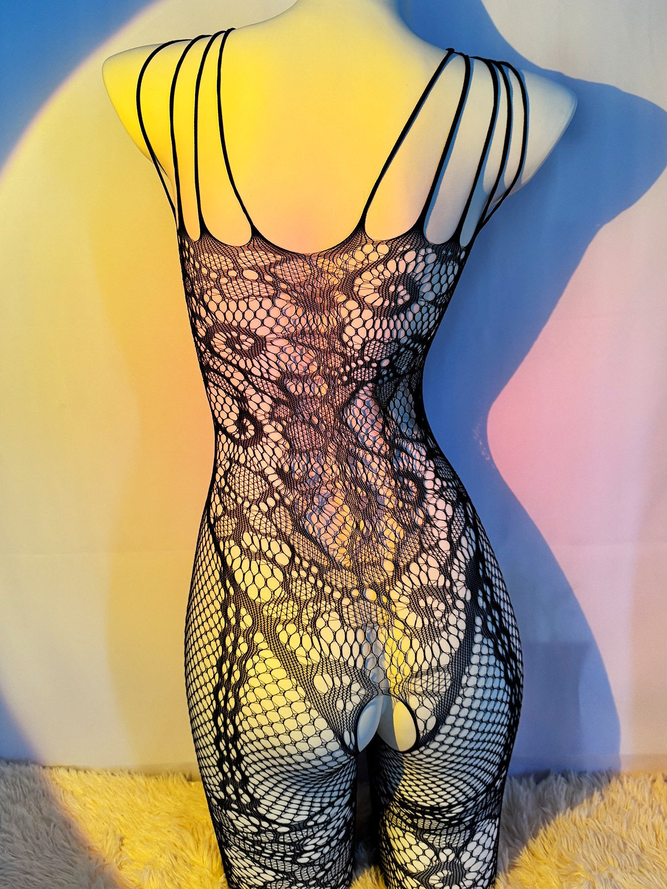 Seductive fishnet bodysuit with jacquard sleeves, crotchless design, and garter socks. Perfect Valentine's Day gift with high quality, comfortable, and stretchy fabric that fits just right.