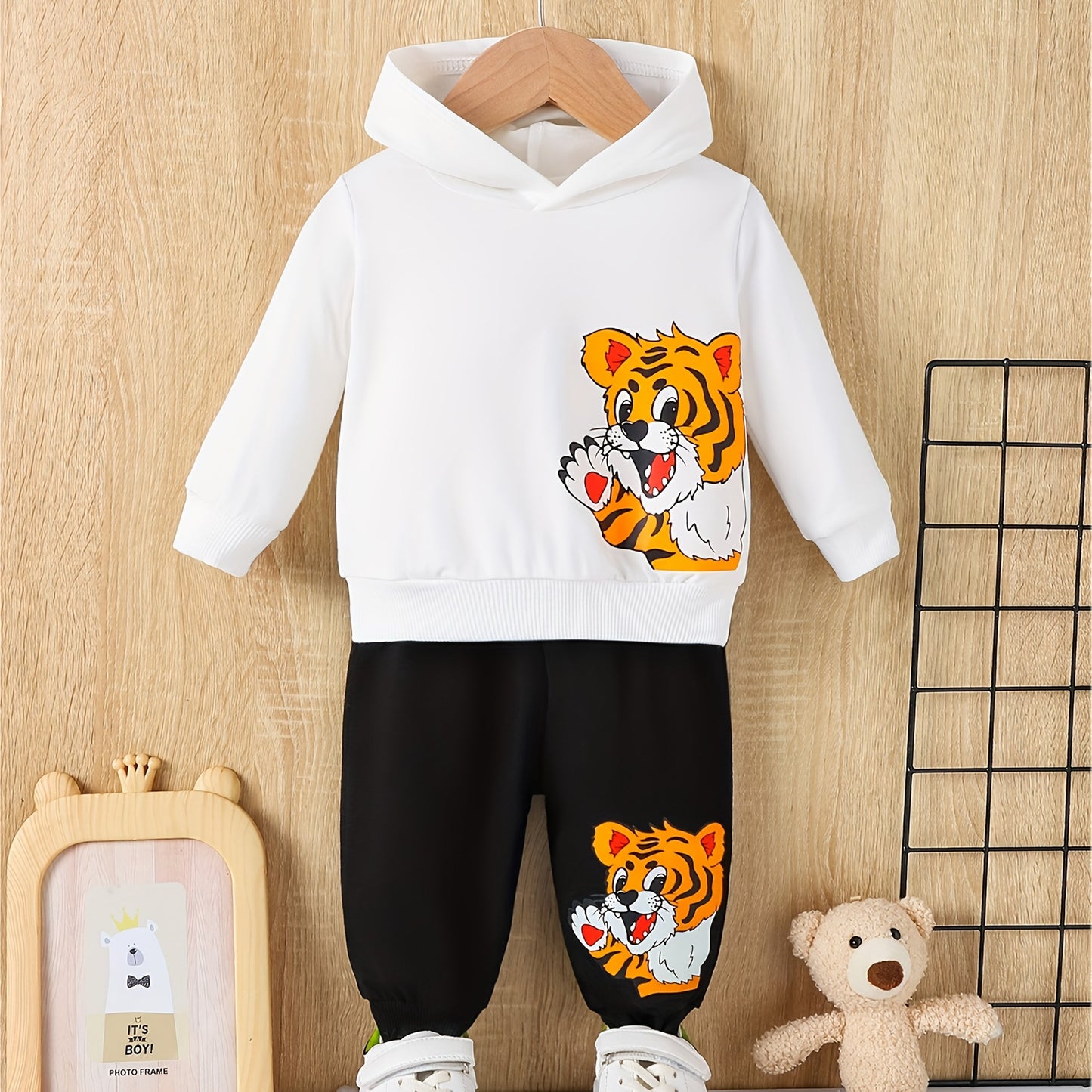 Toddler boy's outdoor fall/winter outfit with long sleeve sweatshirt and casual pants.