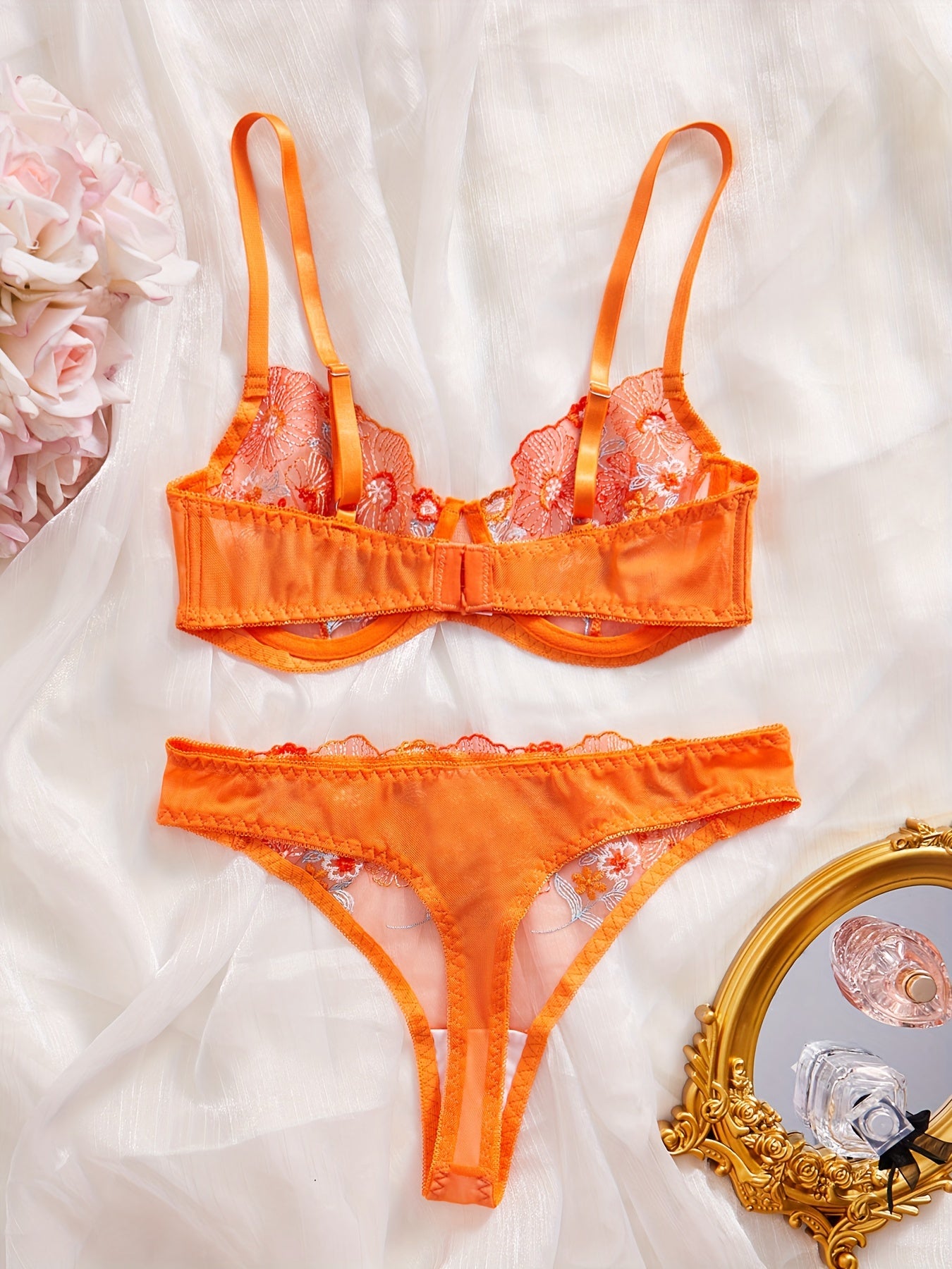 Lace flower embroidery lingerie set, includes bra and thong for women.