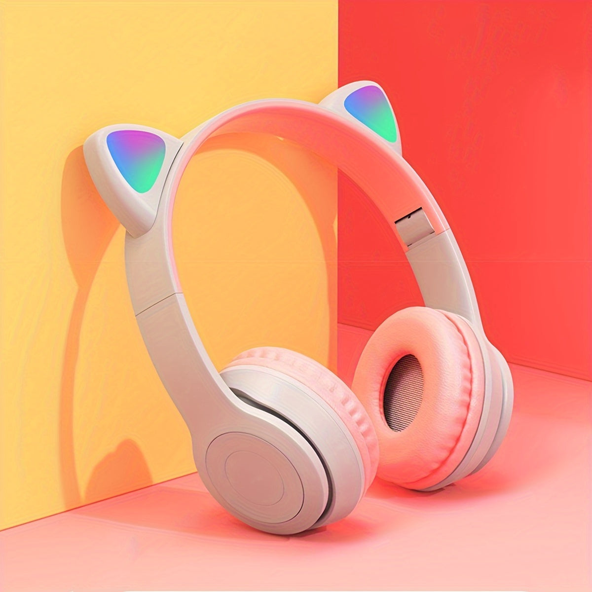 Wireless LED headphone ear muffs with foldable design, volume control, and rechargeable battery for various devices.