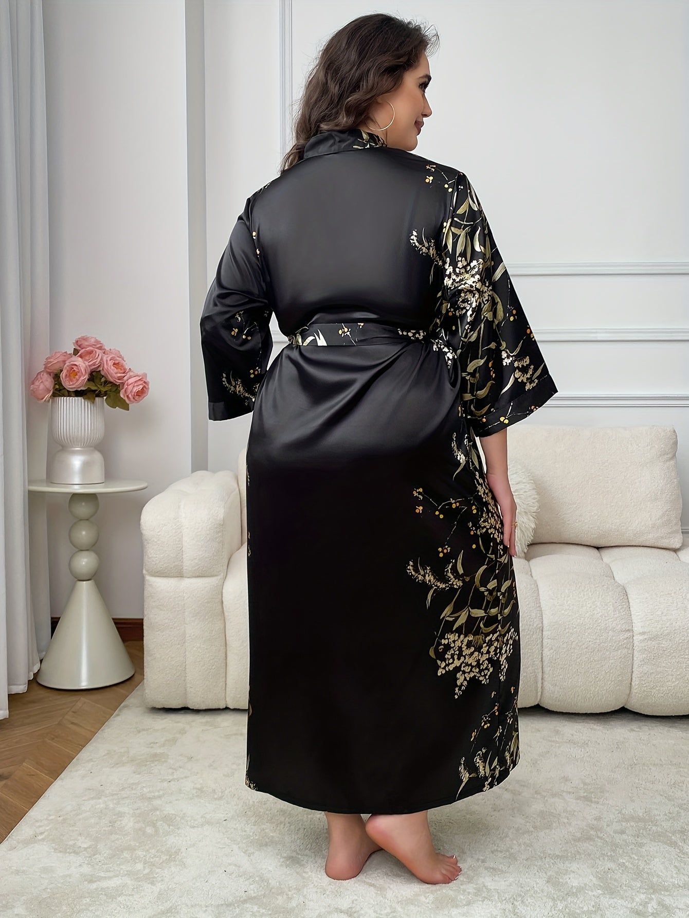 Elegant floral satin kimono robe for plus-size women in black and golden print, with V-neck, long sleeves, belt, and cozy polyester material. Perfect for fall and winter.