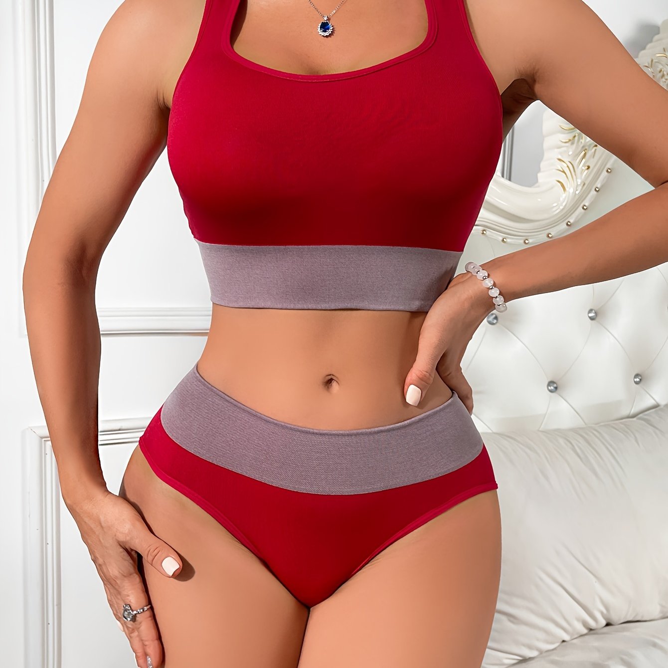 Colorblock yoga lingerie set for women - includes sexy racerback crop top and low-rise briefs with contrasting gray detail, made from breathable nylon blend.