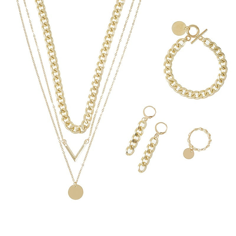 Choose your style with this trendy hip hop jewelry set featuring a 14k gold plated V shape pendant and chain design. The set includes 5 pieces - a necklace, bracelet, earrings, and ring. Available in golden or silvery tones, make your call now.