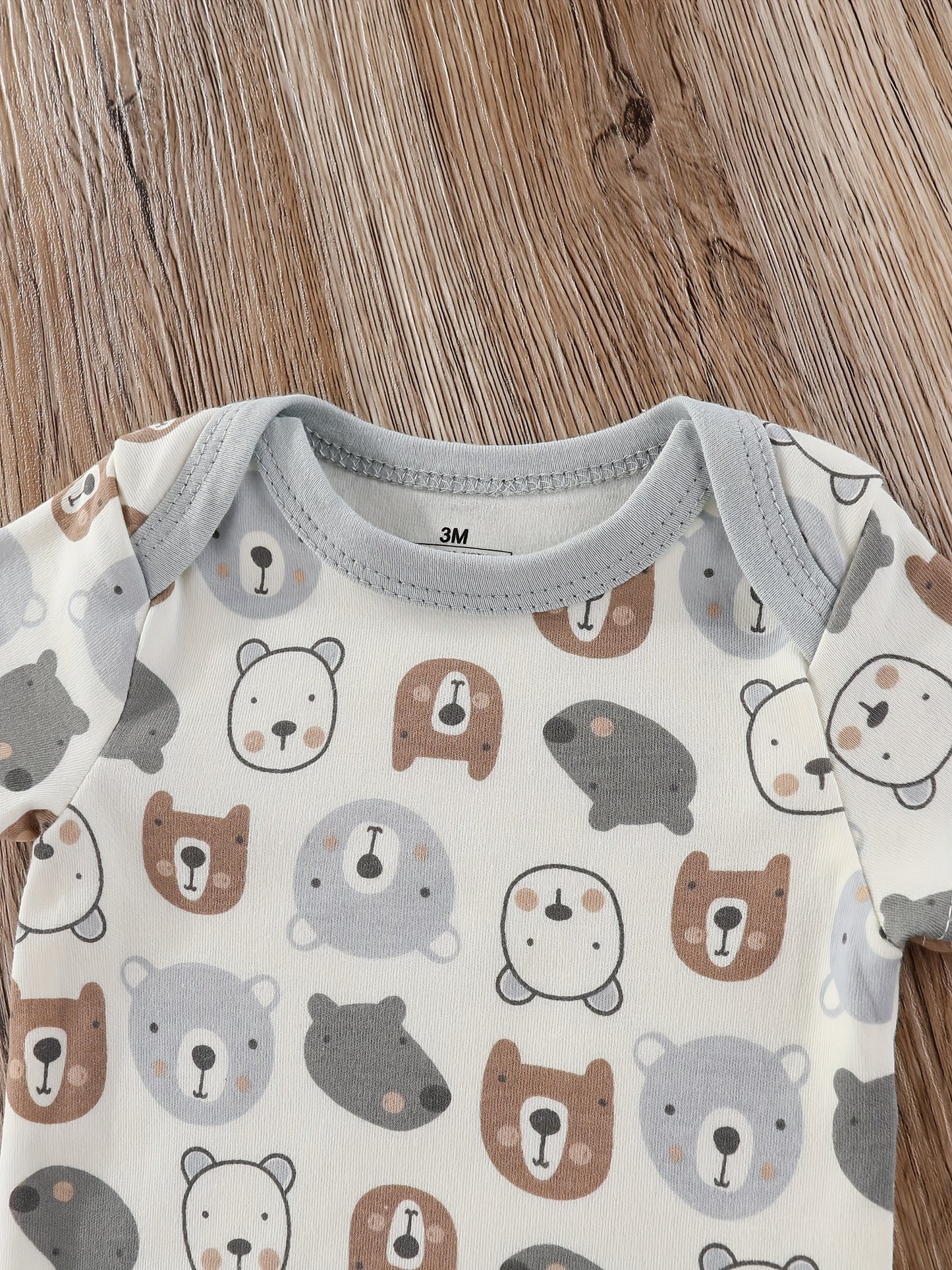 Baby boy's short sleeved cotton jumpsuit featuring plain color, stripes, bear embroidery, and bear heads print. Soft, breathable, and perfect for summer daily and outdoor wear.