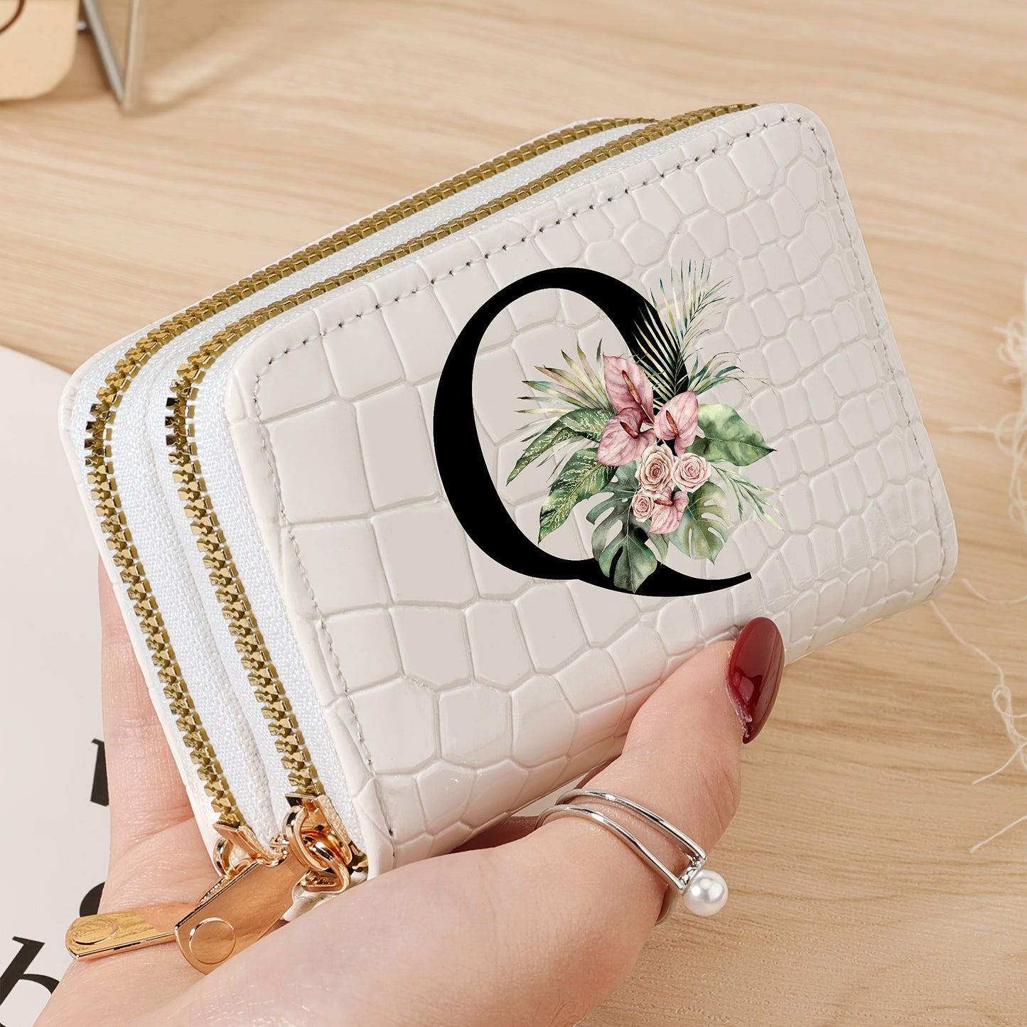 Women's credit card wallet with elegant floral letter print in black & white. Features large capacity, dual zipper, crocodile texture PU, lightweight design with nylon lining for everyday