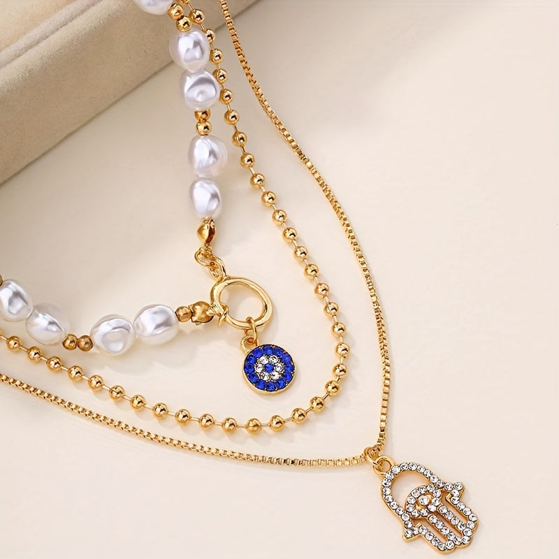 Multi-layered imitation pearl necklace featuring evil eye and Hamsa hand pendants, designed in classic punk style. Made with synthetic stones, alloy material, and no plating. Suitable for both men and women for everyday and vacation wear. Can be worn in