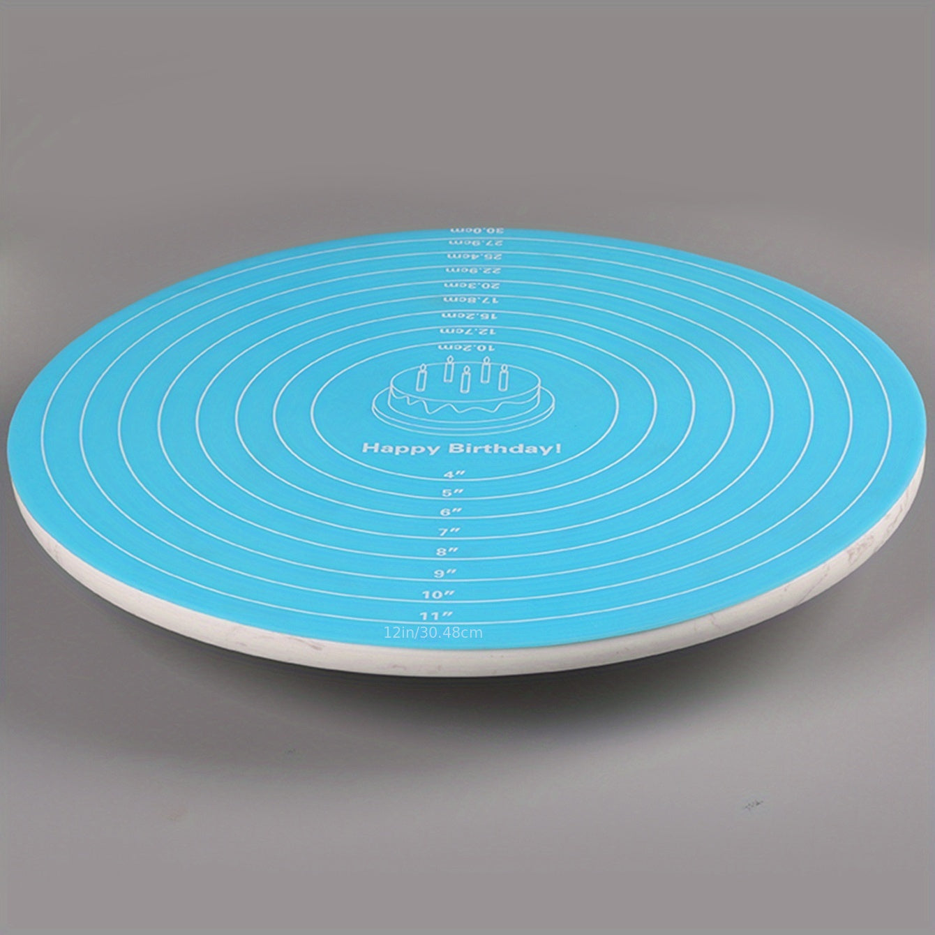 Silicone baking mat with measurements for cake turntable stand, non-stick and heat resistant. Perfect for pastry baking.