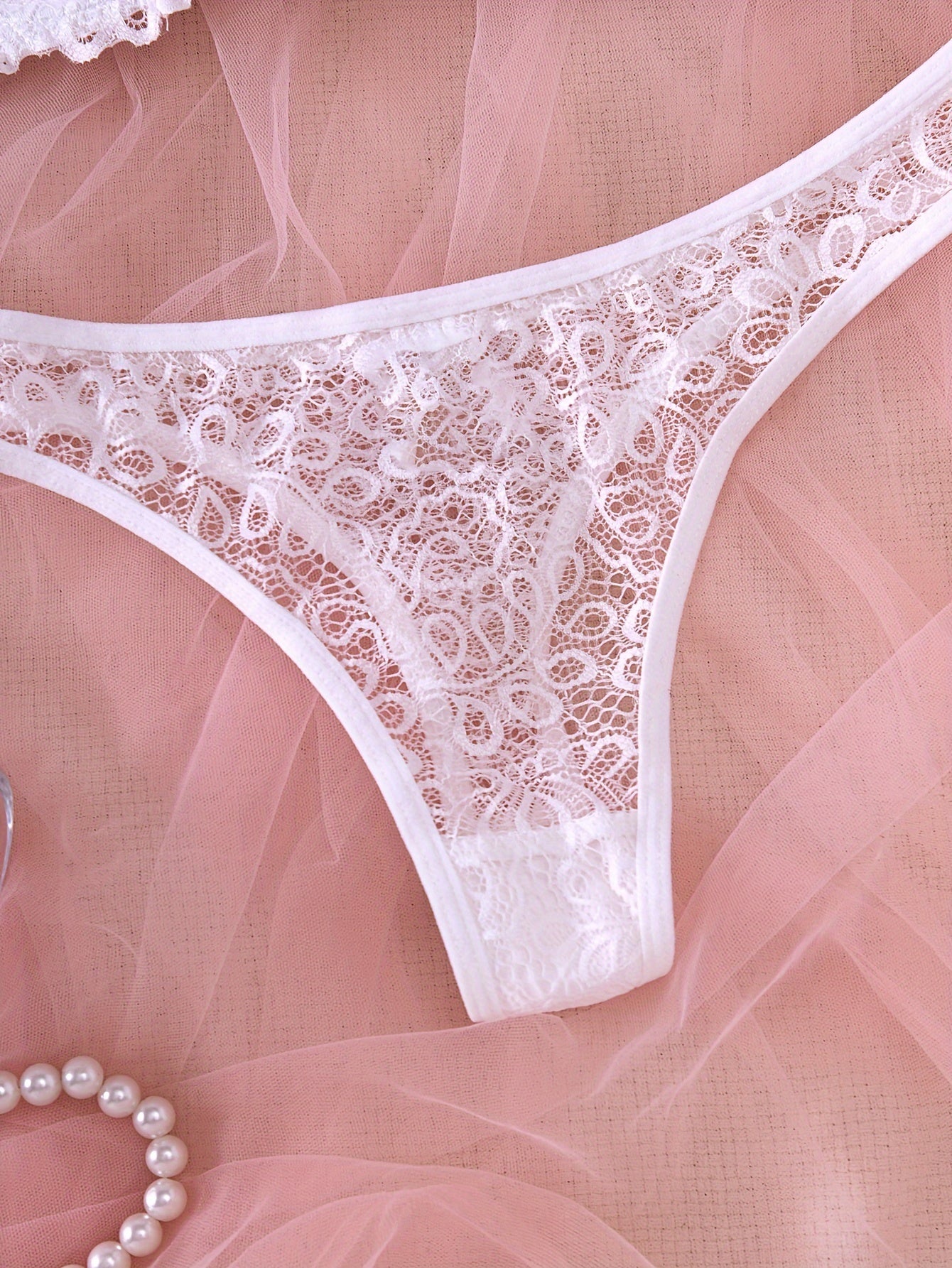 Lace bra and panty set with mesh details, revealing yet comfortable design.