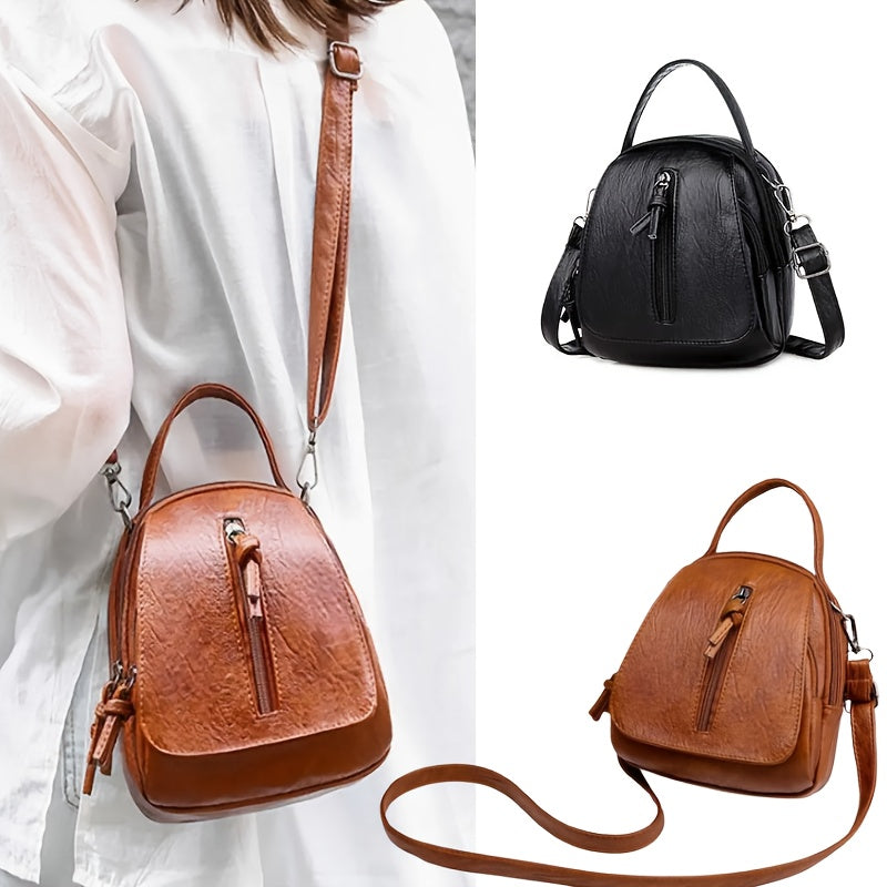 Unisex brown PU crossbody bag with zipper.