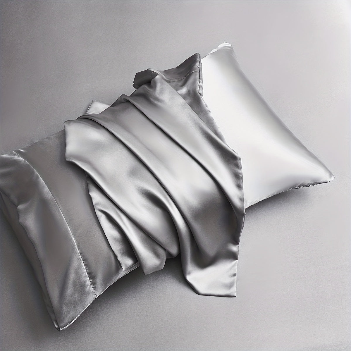 Two pieces of satin pillowcases available in solid colors perfect for the living room or bedroom. Pillow inserts are not included.