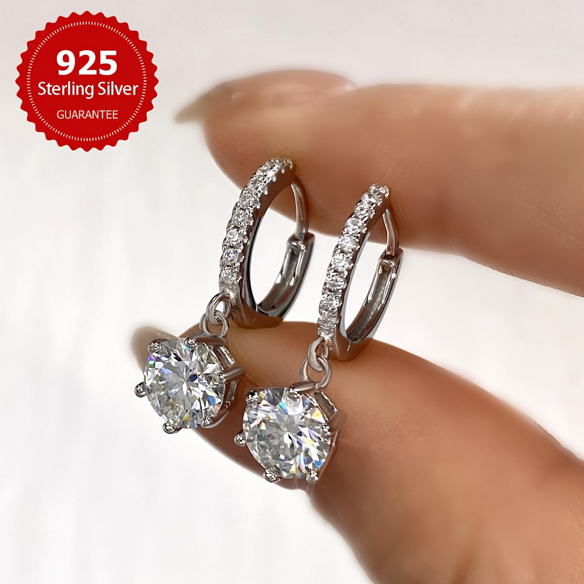 Sparkling 1CT Moissanite Earrings (1CT*2pcs=2CT, Silvery Weight Approximately 2.6g), perfect for weddings or Valentine's Day. Made of 925 Pure Silver with a six-claw design, these earrings exude a noble luxury. The ultimate gift for your loved one.