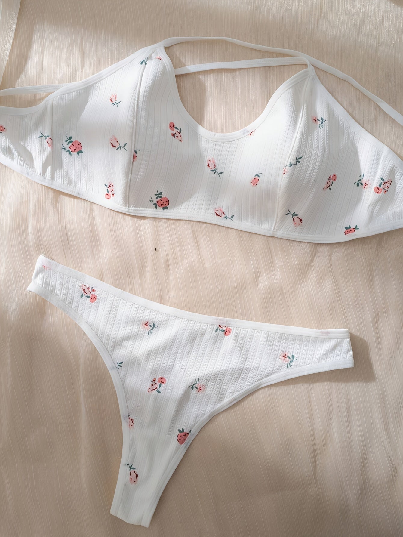 Stylish floral print lingerie set with cross straps, for women.