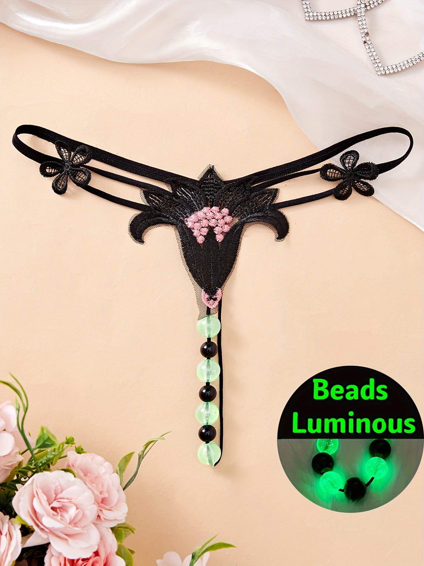 Large luminous beaded massage thong for women - perfect for nights out.