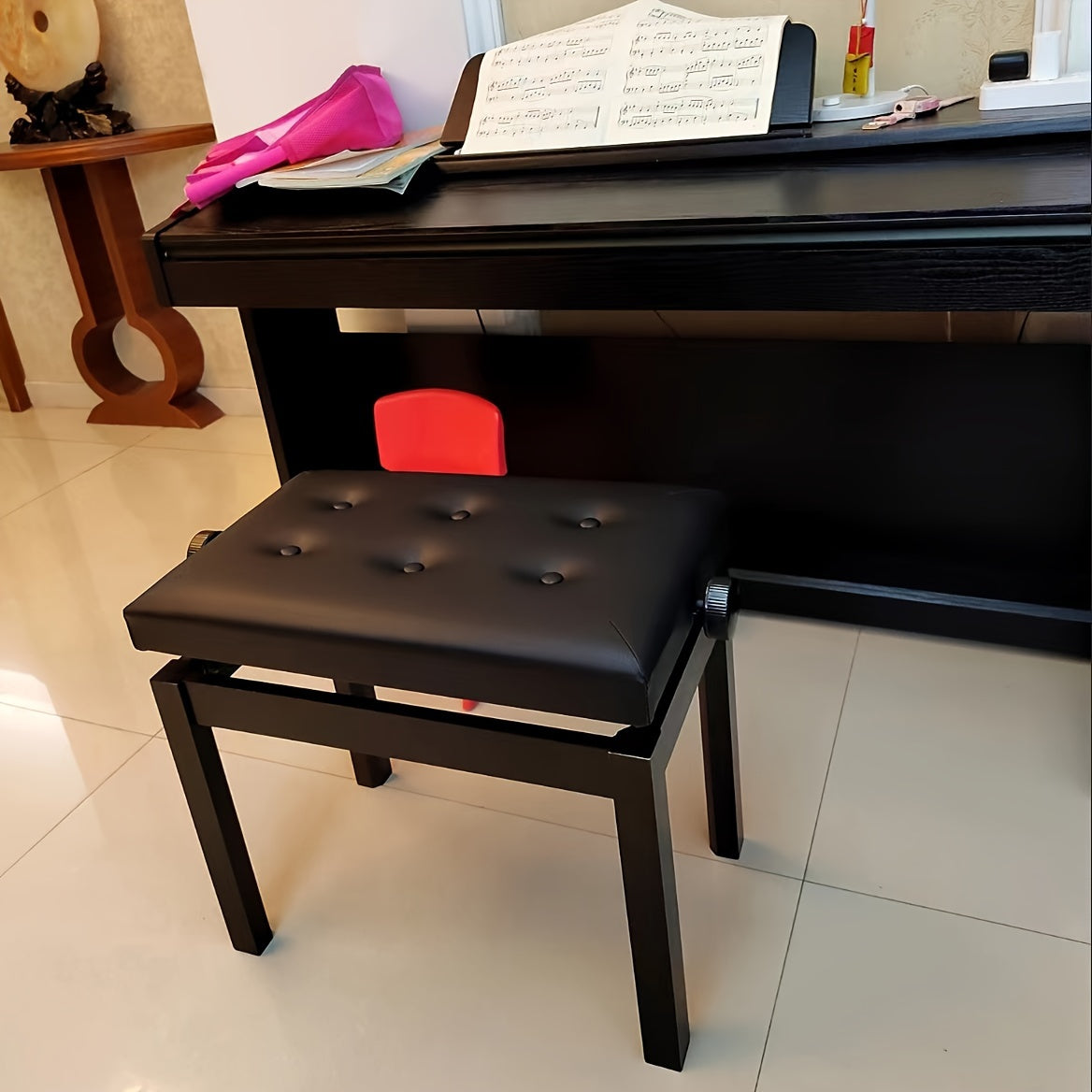 Piano stool with adjustable height, button-tufted black cushion, high elasticity sponge, and durable wooden frame. Ideal for musicians.