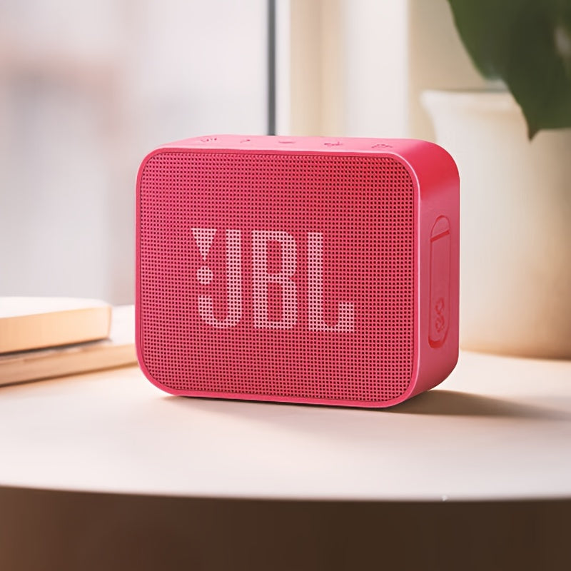 Compact JBL GO ESSENTIAL speaker in Golden Brick Youth Edition with vibrant bass, wireless connectivity, and USB charging. Perfect for use at home, in the car, or outdoors.