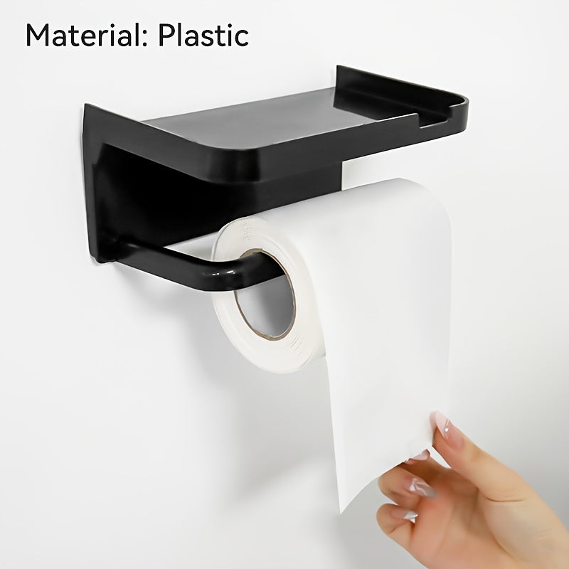 Self-adhesive toilet tissue holder with drawer for tissue and phone storage.