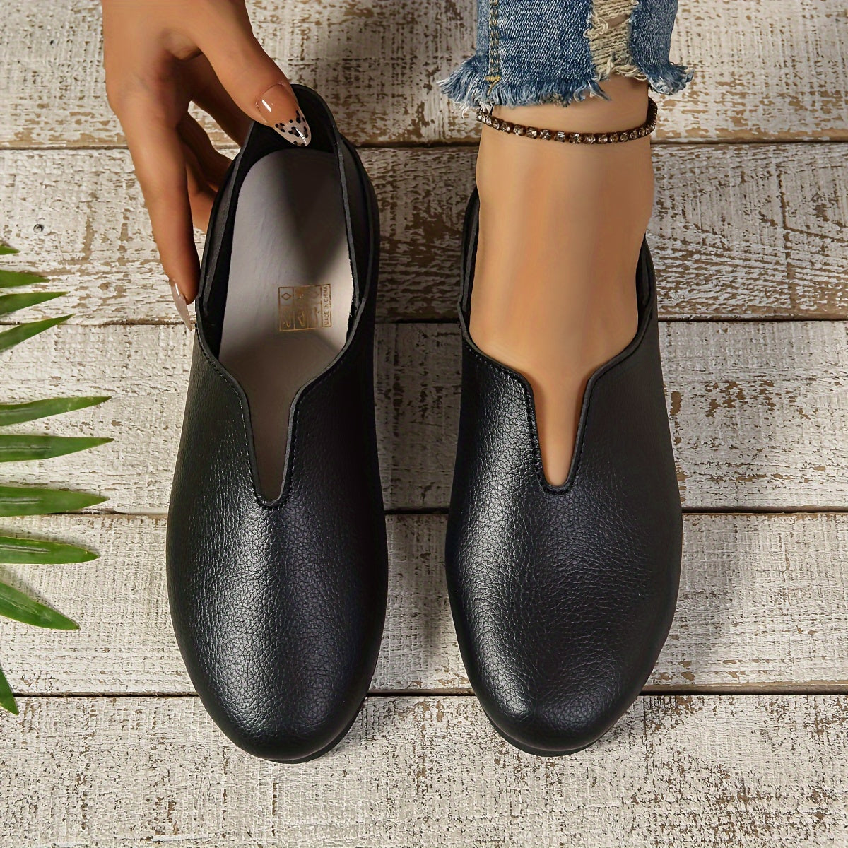 Women's slip-on loafers with round toe, solid color, faux sole, and fabric lining.