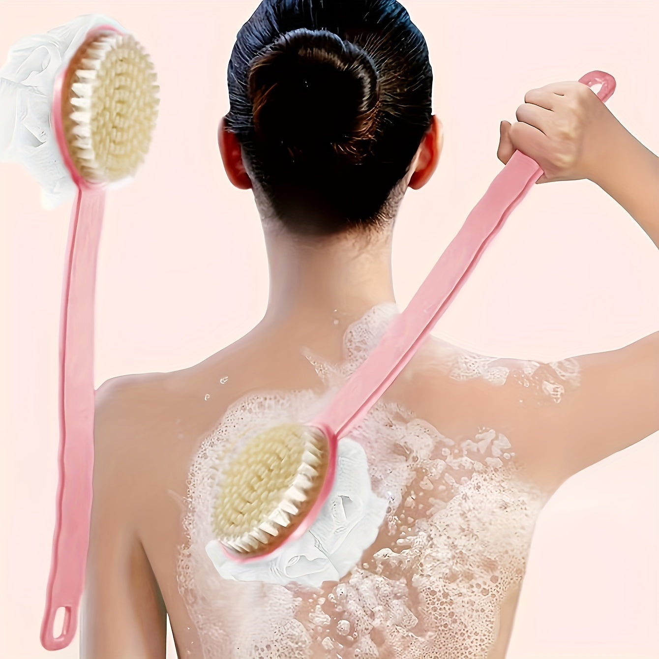 Long-handled back scrubber with soft bristles and bath ball for bathing.