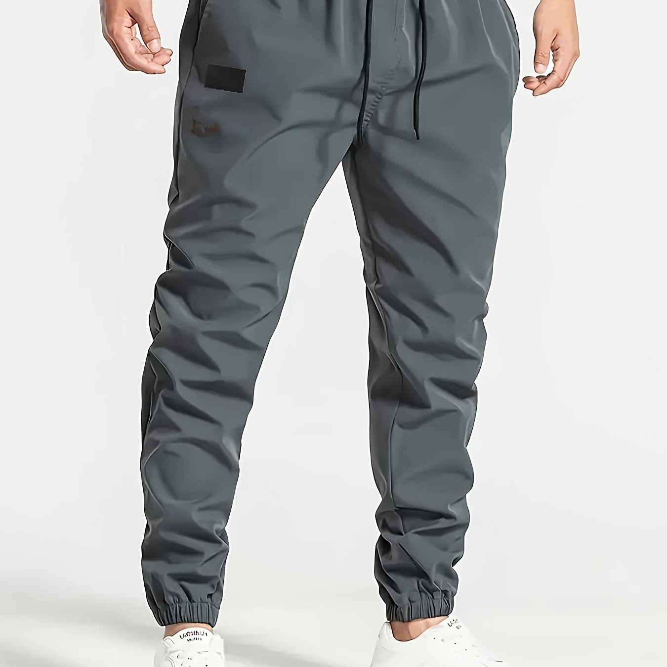 Men's Beige Cargo Pants with Multiple Pockets - Machine washable, comfortable loose fit, ideal for outdoor activities, made of durable polyester fabric.