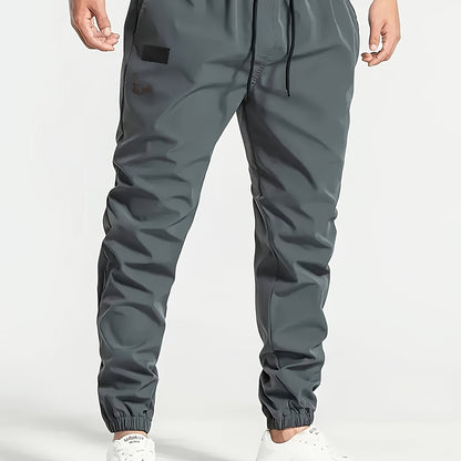 Men's Beige Cargo Pants with Multiple Pockets - Machine washable, comfortable loose fit, ideal for outdoor activities, made of durable polyester fabric.