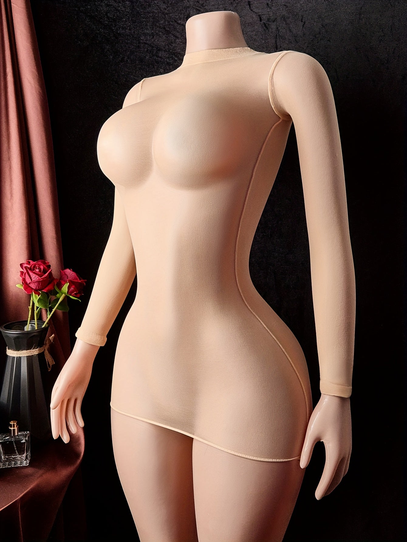 Women's sheer tights bodysuit with fishnet design and crotch cut-out, revealing teddy lingerie.