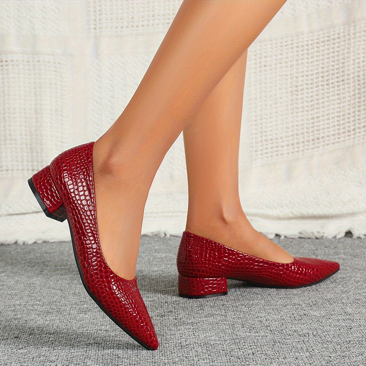 Stylish red snakeskin pattern pumps with pointed toe, low heel, and lightweight PU cover - perfect for weddings and parties. versatile and comfortable design for ladies.